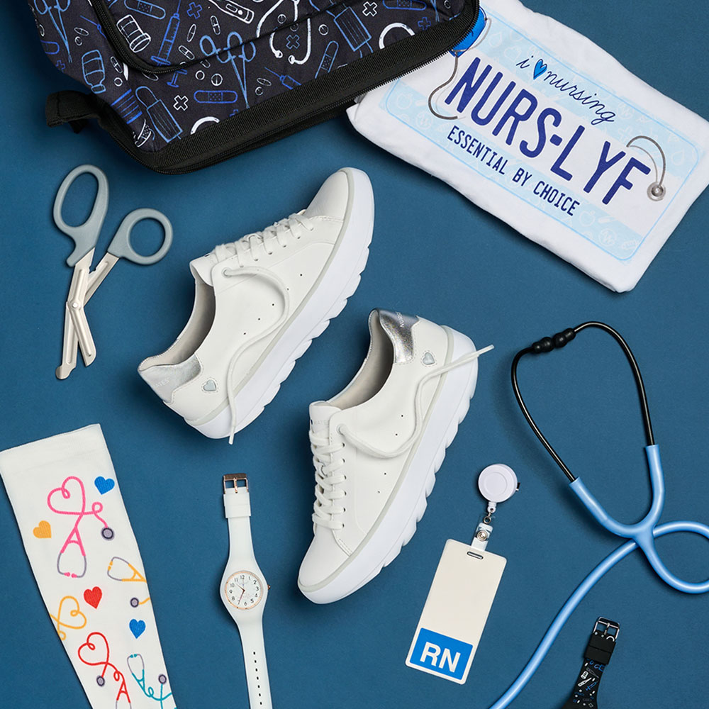 Womens Nrs Lyf Tee Shirt in white, the Ultimate Nursing Backpack in Black with A Black Medical Pattern, Align™ Velocity Sneakers in White, Uni-Watch in White, Uni-Watch in Black with Medical Symbols, Compression Socks 360 in multicolor with Stethoscope Hearts, and Medical Utensils and Tools.