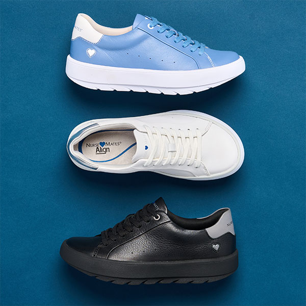 The Calliope lace-up sneaker in Blue, White and Black shown on a dark blue background. Shop this shoe in blue.