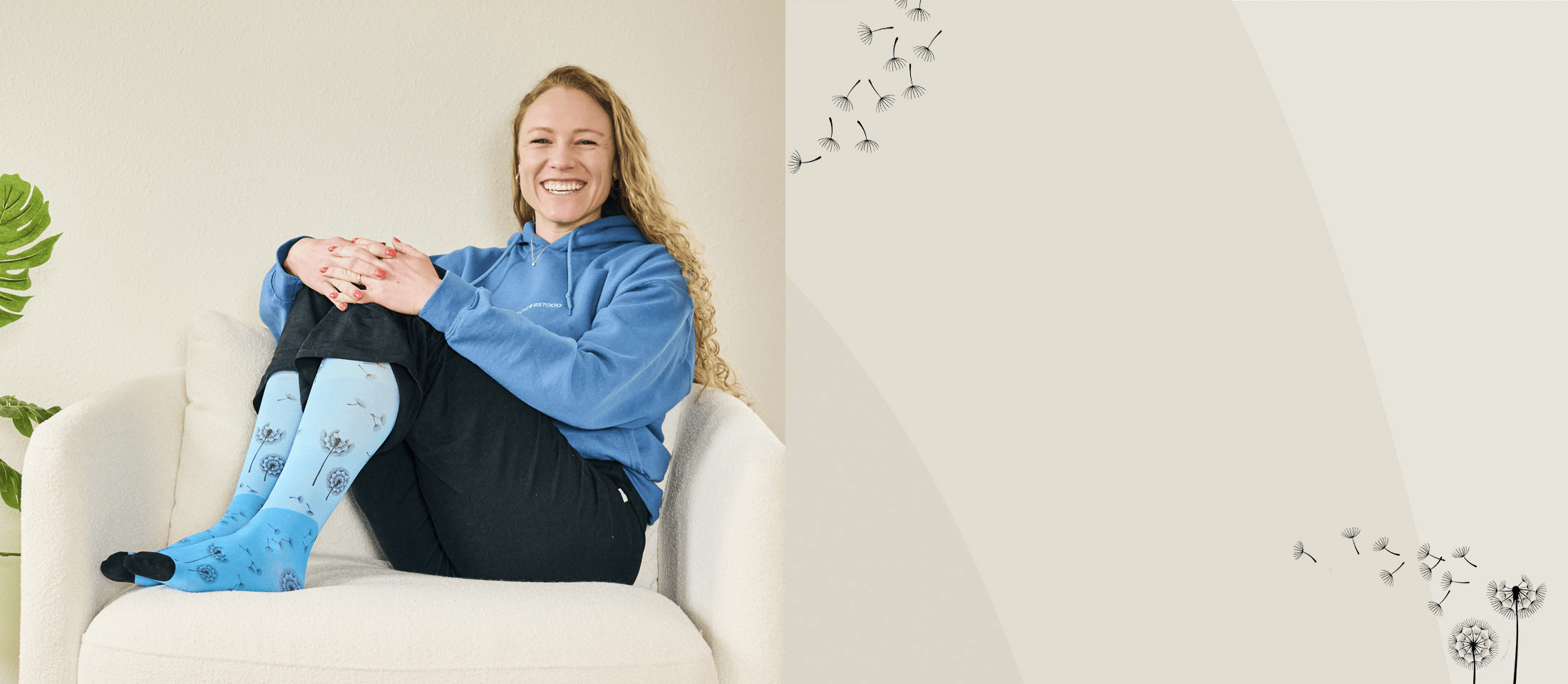 A woman sitting in a chair wearing blue compression socks.