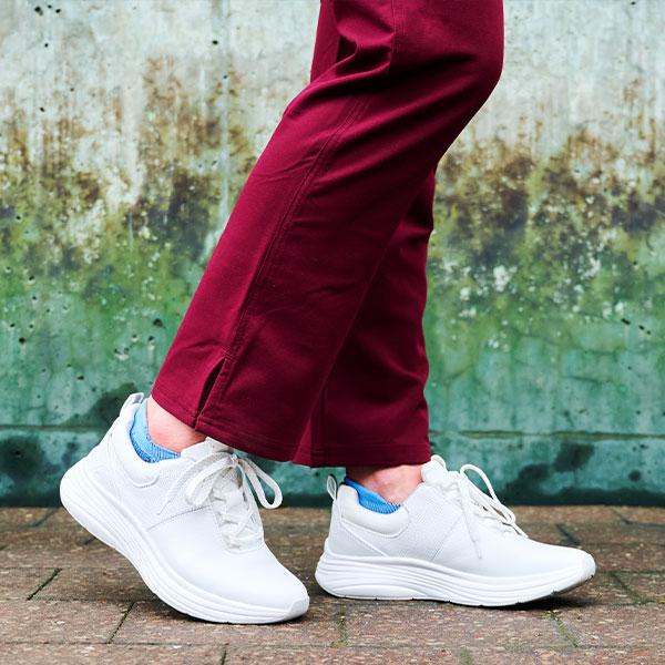 Women’s Align™ Tulia in White shown on foot walking on a sidewalk. Shop this shoe in black.